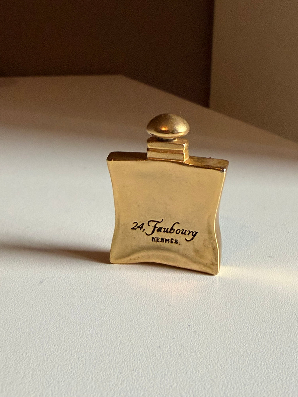 Vintage Hermès 24 Faubourg Perfume Bottle Brooch – Gold Tone – Rare Collector’s Piece